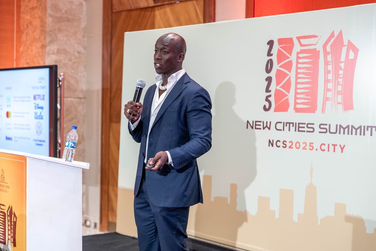 Speaker presenting at the New Cities Summit 2025 main stage